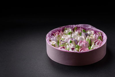 Close-up of food in bowl against black background