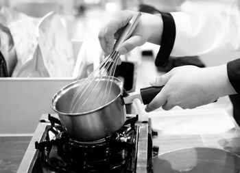 Midsection of man preparing food