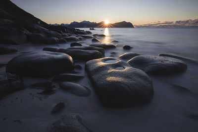 Rocks and water in vareid beach in lofoten