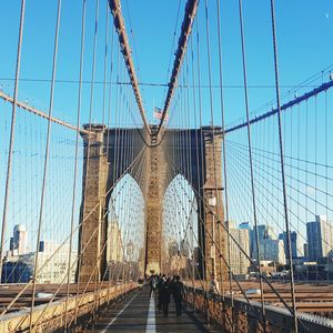 Suspension bridge against blue sky