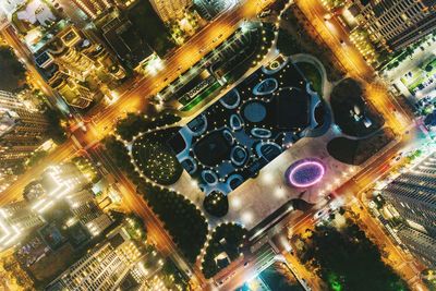 High angle view of city lit up at night