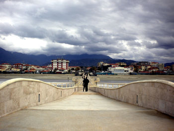 View of city against cloudy sky