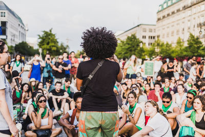 Group of people in town square