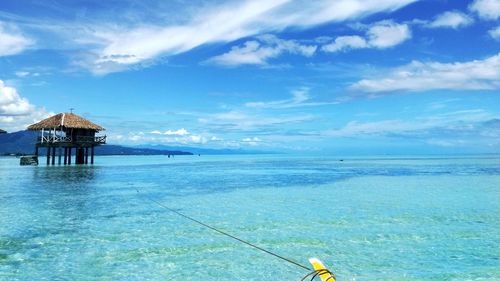 Scenic view of sea against blue sky