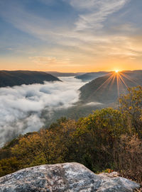 Scenic view of mountains against sky during sunset