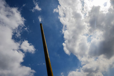 Low angle view of pole against blue sky