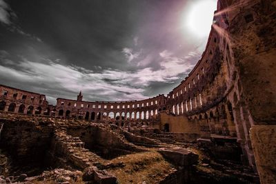 Ruins against sky on sunny day