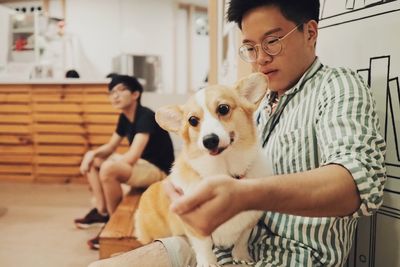 Man and dog sitting outdoors