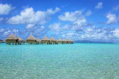 Scenic view of calm sea against cloudy sky