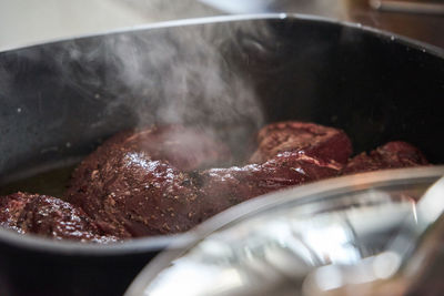 Close-up of meat on barbecue grill