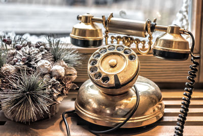 Close-up of telephone on window sill