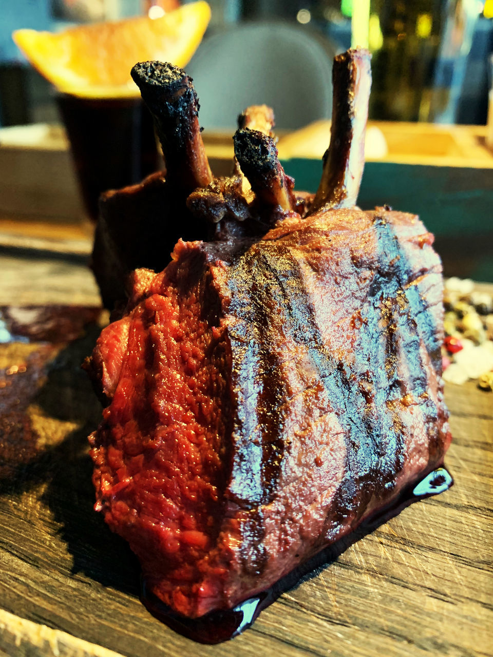 CLOSE-UP OF MEAT COOKING ON BARBECUE