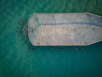 Aerial view of metallic structure in water or pier