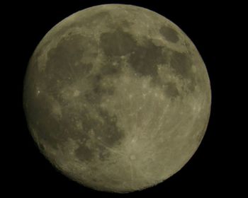 Low angle view of moon against sky at night