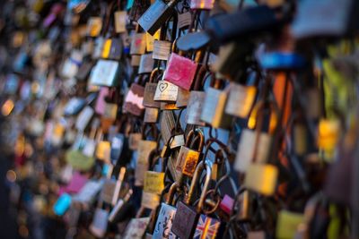 Close-up of padlocks on railing