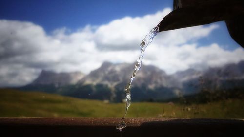 Close-up of water drop against blurred background