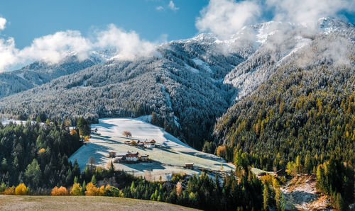 Aerial view of snowcapped mountains against sky