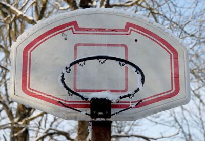 Close-up of stop sign on snow