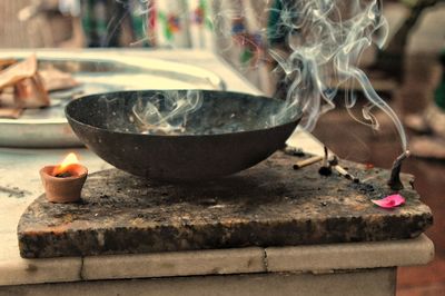 Close-up of burning candles on temple