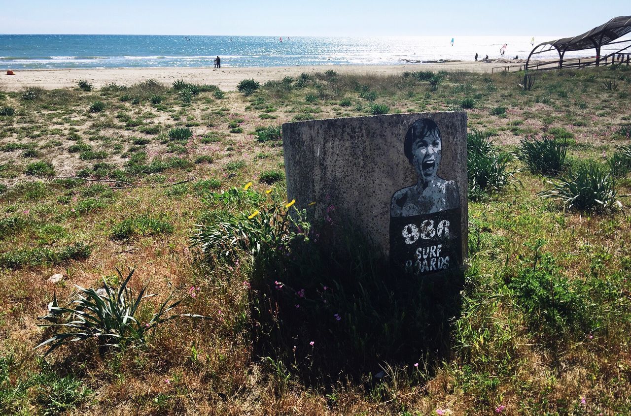 TEXT ON BEACH AGAINST CLEAR SKY