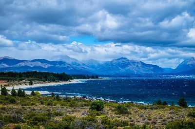 Scenic view of mountains against cloudy sky