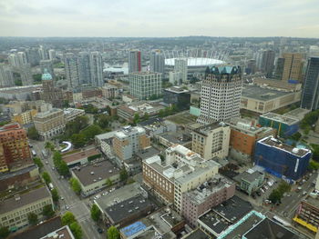 High angle view of buildings in city against sky