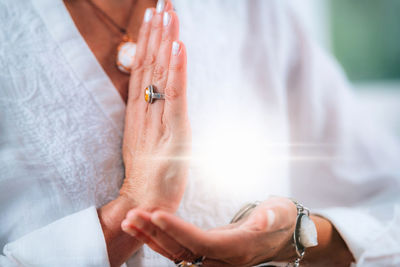 Sense of purpose meditation. hands of a emotionally aware person during meditation, helping people 