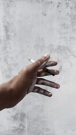 Cropped hand of person with nail polish