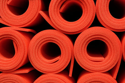 Full frame shot of rolled exercise mats
