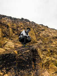 Low angle view of rock formation against mountain