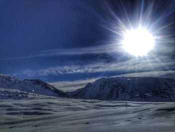 Scenic view of snow mountains against sky