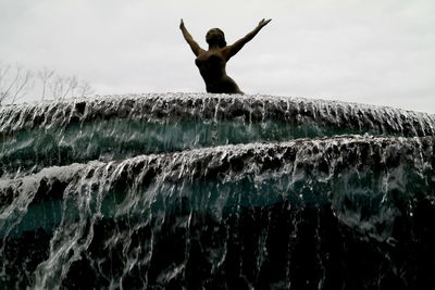 Full length of man standing by sea against sky