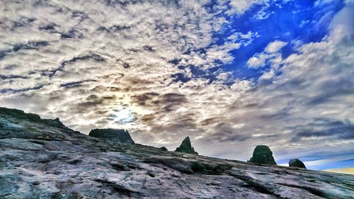 Scenic view of rocks and sea against sky