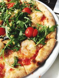 Close-up of pizza served on table
