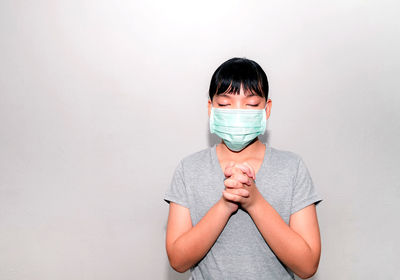 Portrait of boy against white background