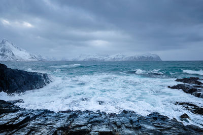 Norwegian sea waves on rocky coast of lofoten islands, norway