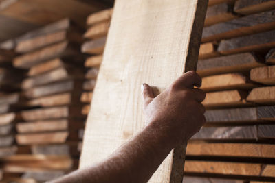 Close-up of hand holding wood