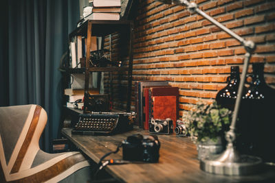 Potted plant on table against wall