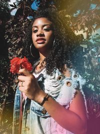 Beautiful young woman looking at camera