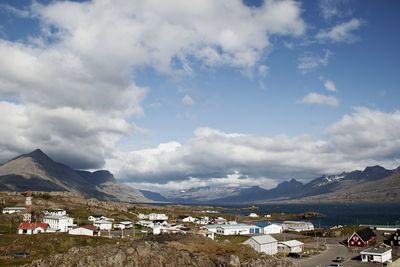 View of town against cloudy sky