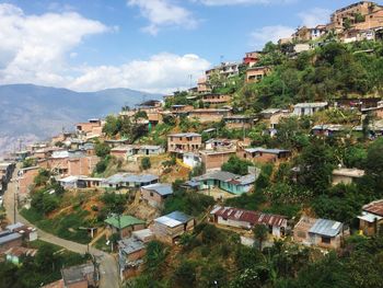 Houses in town against sky