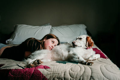 Dog lying down on bed