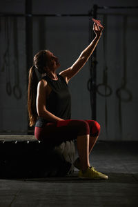 Woman sitting on floor at home