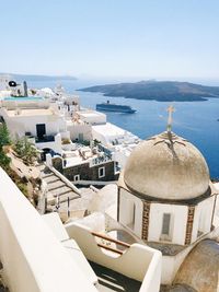 High angle view of buildings by sea