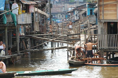 Boats in canal along buildings