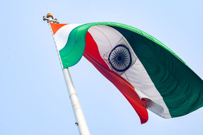 Low angle view of flag against clear sky