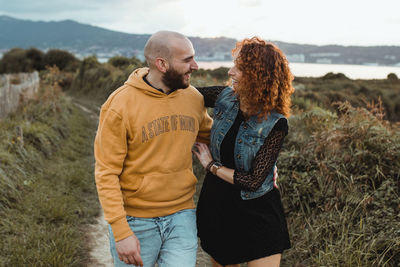 Young couple standing on land