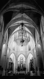 Low angle view of chandelier hanging in building