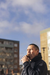 Mature man eating ice-cream