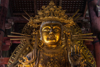 Close-up of statue against building